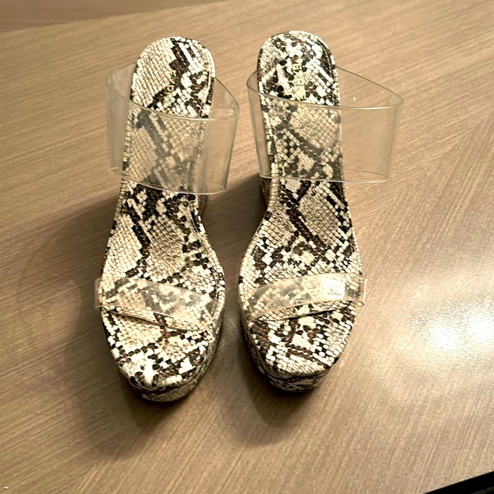 Express wedges with clear straps and faux  snake print bottom.